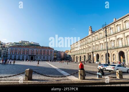 Naples, Italy - September 9, 2019: Facade of the Royal Palace of Naples (Palazzo Reale di Napoli) and the Territorial Office of the Government of Napl Stock Photo