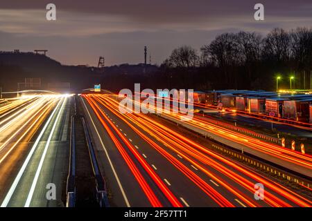 Evening traffic on the A2 motorway at the Recklinghausen junction heading west, in the background the winding frames of the former Ewald colliery, Hoh Stock Photo
