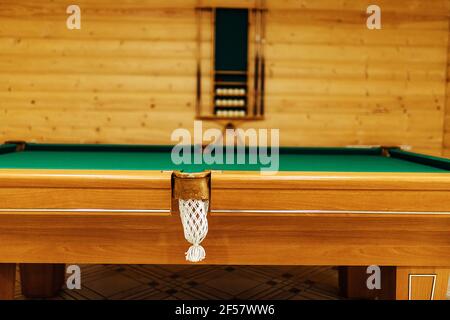 pool table in the sauna. recreation and sports entertainment sports entertainment during your vacation. wooden table with green cloth in a private hou Stock Photo