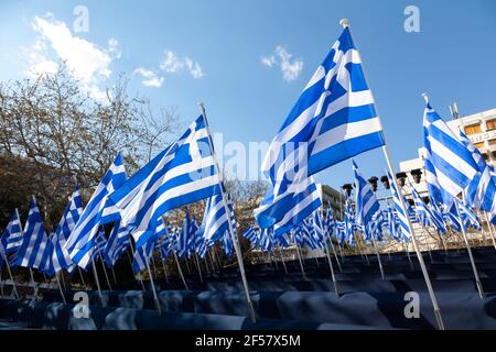 Greek flags waving in Syntagma Square, Athens, Greece, during the celebrations for the 200 years of the Greek Independence Day (March 25th 1821-2021). Stock Photo