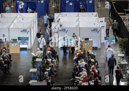 (210324) -- PARIS, March 24, 2021 (Xinhua) -- People wait in a COVID-19 vaccination center at the National Velodrome de Saint-Quentin-en-Yvelines in Saint-Quentin-en-Yvelines, France, on March 24, 2021. French President Emmanuel Macron on Tuesday stressed the importance of vaccination as the country's COVID-19 cases kept rising. Since the start of the vaccination campaign in France, nearly 6.6 million people, or about 12.6 percent of the adult population, have received at least one injection, and over 2.5 million have received two injections, according to the Health Ministry. (Photo by Aurelie Stock Photo