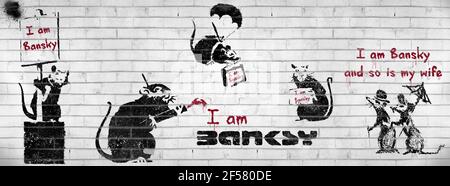 Cartoon Banksy humour, I am Banksy and So is my Wife, fake or genuine wall graffiti. Stock Photo