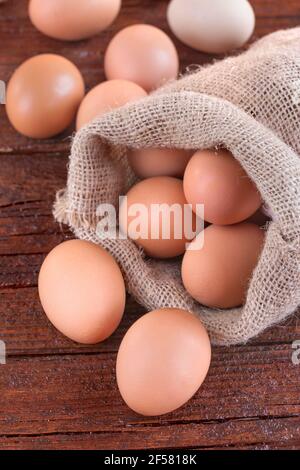 Free-range eggs on a rustic wooden background Stock Photo