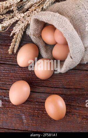 Free-range eggs on a rustic wooden background Stock Photo