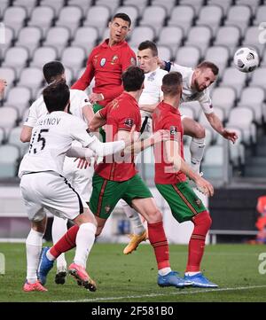 Turin, Italy. 24th Mar, 2020. Portugal's Cristiano Ronaldo (L, top) competes during a FIFA World Cup 2022 qualifier Group A match between Portugal and Azerbaijan in Turin, Italy, March 24, 2020. Credit: Federico Tardito/Xinhua/Alamy Live News Stock Photo