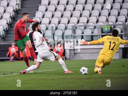 Turin, Italy. 24th Mar, 2020. Portugal's Cristiano Ronaldo (L) shoots during a FIFA World Cup 2022 qualifier Group A match between Portugal and Azerbaijan in Turin, Italy, March 24, 2020. Credit: Federico Tardito/Xinhua/Alamy Live News Stock Photo