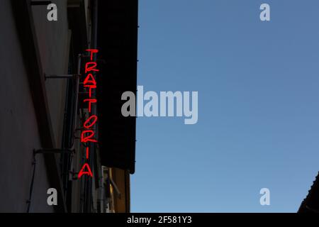 A Red Trattoria Neon Sign in Florence, Italy Stock Photo