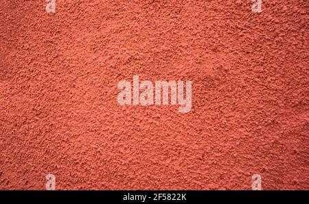 terracotta colored rough granulated paint texture, gotele, russet, reddish or tile color wine color horizontal Stock Photo