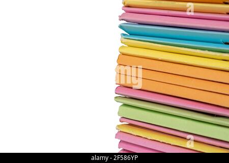 Stack of multi colors file folders for storing paper on white background. Stock Photo