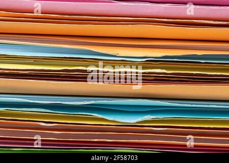 Close up of Stack of multi colors file folders for storing paper. Stock Photo