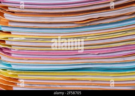 Close up of Stack of multi colors file folders for storing paper. Stock Photo