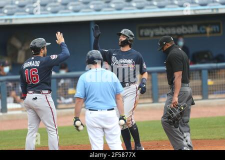 The Braves' Dansby Swanson high fives teammates prior to a game