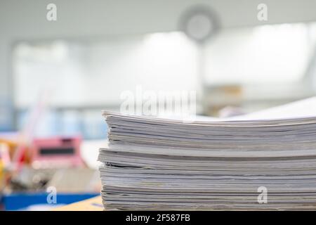 Stack of documents on desktop in office. Stock Photo