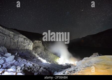 The Blue fire rising up from the Ijen Volcano crater in Eastern Java, Indonesia. Stock Photo