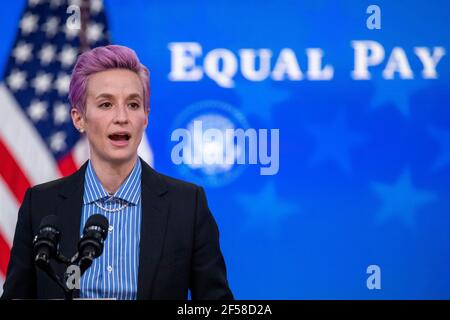 Megan Rapinoe, of the U.S. Soccer Women's National Team, delivers remarks during an event to mark Equal Pay Day in the State Dining Room of the White House in Washington, DC, USA, 24 March 2021. Equal Pay Day marks the extra time it takes an average woman in the United States to earn the same pay that their male counterparts made the previous calendar year.Credit: Shawn Thew/Pool via CNP/MediaPunch