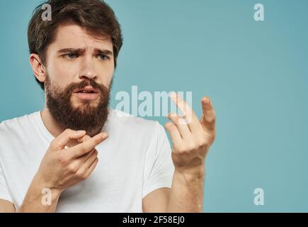 Man indignant look portrait emotions blue background model Stock Photo