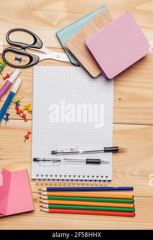 https://l450v.alamy.com/450v/2f58hhx/stationery-on-wooden-table-colorful-pencils-scissors-school-objects-2f58hhx.jpg