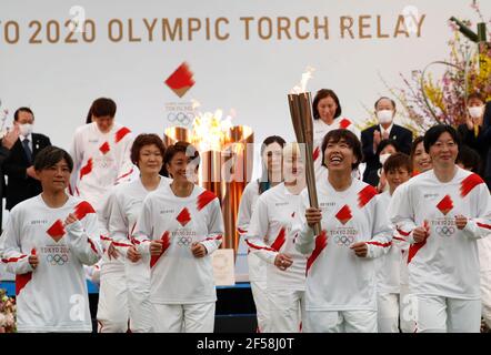 FUKUSHIMA, March 25, 2021  Former members of 'Nadeshiko Japan,' the Japan women's National Football Team, run as torchbearers on the first day of the Tokyo 2020 Olympic torch relay at J-Village National Training Center in Futaba, Fukushima of Japan, on March 25, 2021. (Kim Kyung-Hoon/Pool via Xinhua) Stock Photo