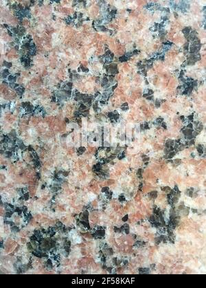 Polished pink and black granite stone texture background Stock Photo