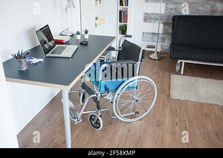 Wheelchair for handicapped patient with mobility disability. No patient in the room in the private nursing home. Therapy mobility support elderly and disabled walking disability impairment recovery paralysis invalid rehabilitation Stock Photo