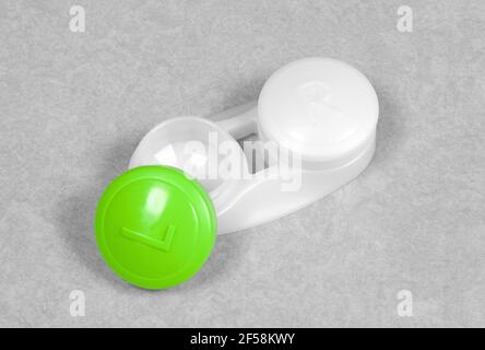 Green contact lens case, isolated on grey background Stock Photo