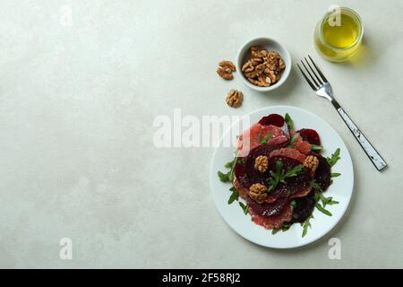 Concept of tasty eating with beet salad on white textured background Stock Photo