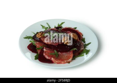 Plate with tasty beet salad isolated on white background Stock Photo