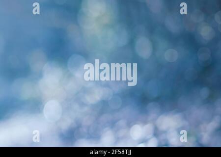 Abstract bokeh blur background with cold blue colors Stock Photo