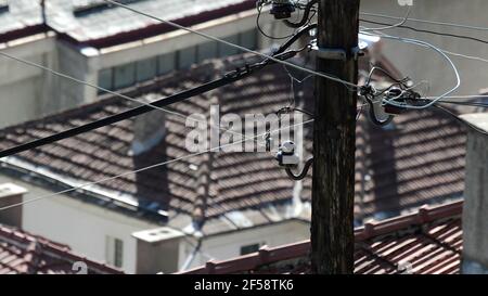 Wooden electric pillar with wires & lamp Stock Photo