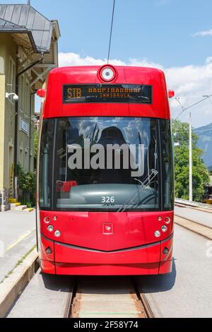 Fulpmes, Austria - August 1, 2020: Stubaitalbahn Innsbruck Tram Bombardier train portrait format Fulpmes station in Austria. Stock Photo