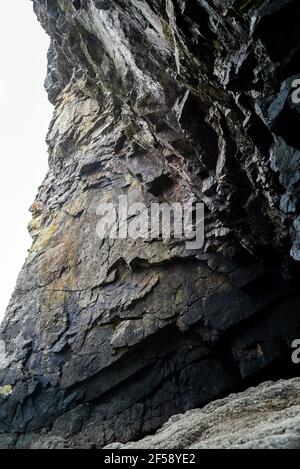 Colorful rock rock texture, geological phenomenon in the rocks above the atlantic ocean. Stock Photo
