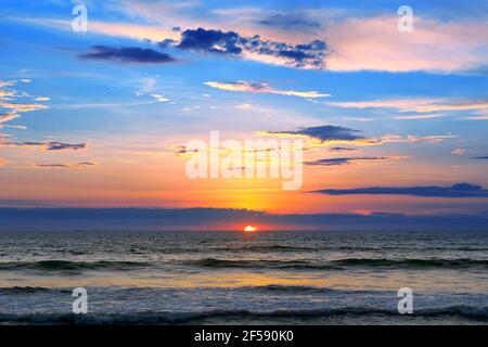 Sea, ocean landscape with fantastic beautiful sky and calm surf Stock Photo