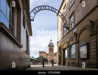 Chesterfield Town hall with clock and outdoor market place taken from The Shambles shops on summer day beautiful old medieval town with crooked spire. Stock Photo