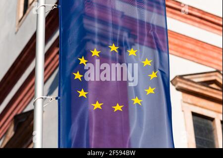 Closeup of the flag of the European Union in front of church in Mariazell (Austria), sunny day in springtime Stock Photo