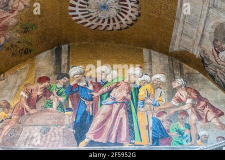 Venice, Italy - June 23 2020: A close up view of the 'Theft of the Body of Saint Mark from Alexandria' Mosaic that ornates the exterior of the Saint M Stock Photo