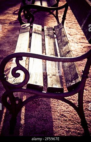 antique empty bench in a park Stock Photo