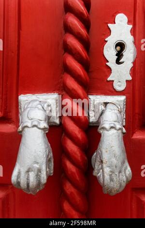 Door knockers in the form of a hand, Algarve, Portugal Stock Photo