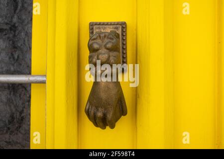 Door knocker in the form of a hand, Algarve, Portugal Stock Photo