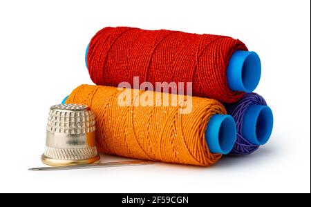 Tailor, needles and threads over white background Stock Photo