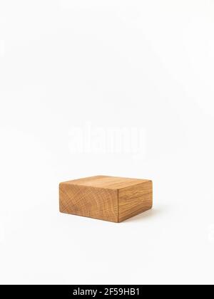 Empty wood cube podium for products presentation. Display stand on white background. Front view. Copy space. Stock Photo