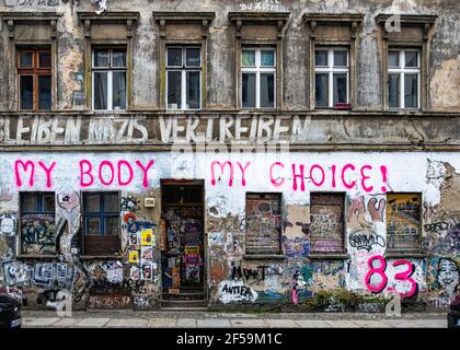 .Old squat building detail, weathered wall, graffiti, urban art, Linien strasse 206, Mitte, Berlin. My Body My choice 83 - political inscription Stock Photo