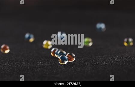 Group og glass marbles on dark surface Stock Photo