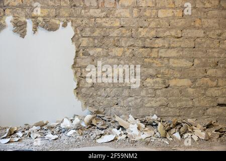 old brick wall restoration. plaster removal Stock Photo