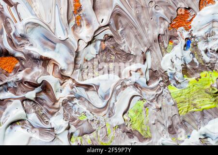 Colorful brush strokes, stains of colored acrylic paint on the artist's palette. Abstract modern background, grunge texture Stock Photo