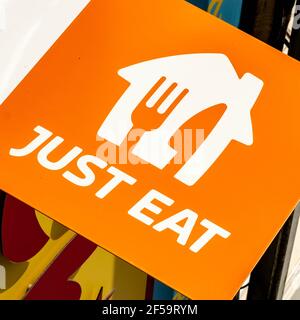 London UK, March 25 2021, Just Eat Home Takeaway Delivery Service Logo Close Up With No People Stock Photo