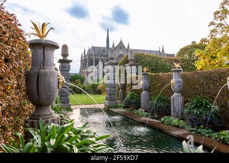 The neo-Gothic cathedral seen from the Arun Fountain in the Collector Earl's Garden, Arundel Castle, West Sussex, England, UK Stock Photo