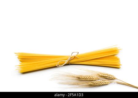 Top view of spaghetti bunch with ears on white background Stock Photo