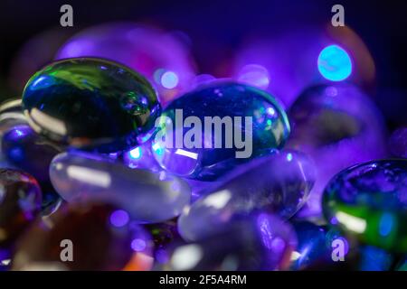 Background formed by a wall made of colored glass stones Stock Photo