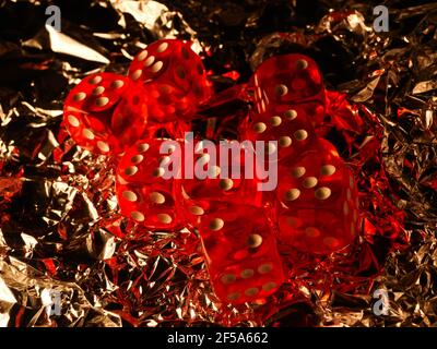 Red dices on grey background Stock Photo