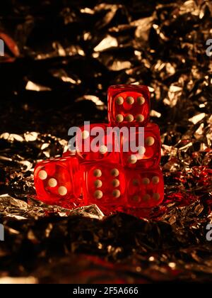 Red dices on grey background Stock Photo
